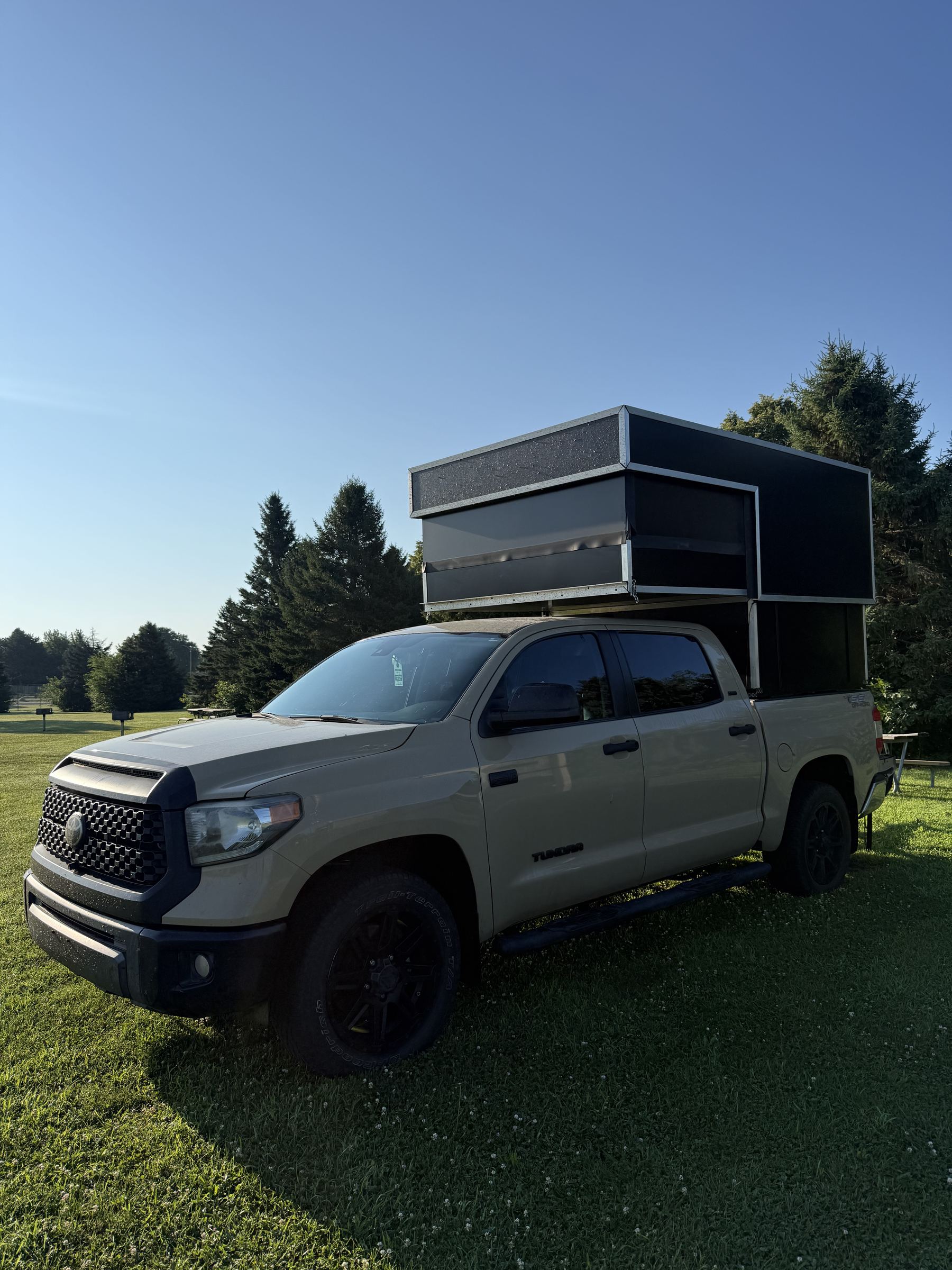 Toyota Tundra with hard-sided electric pop-top camper